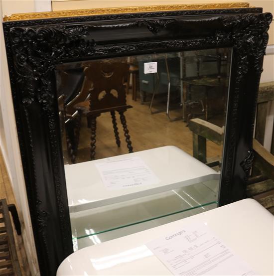 A gilt mirror and an ebonised mirror W.83cm